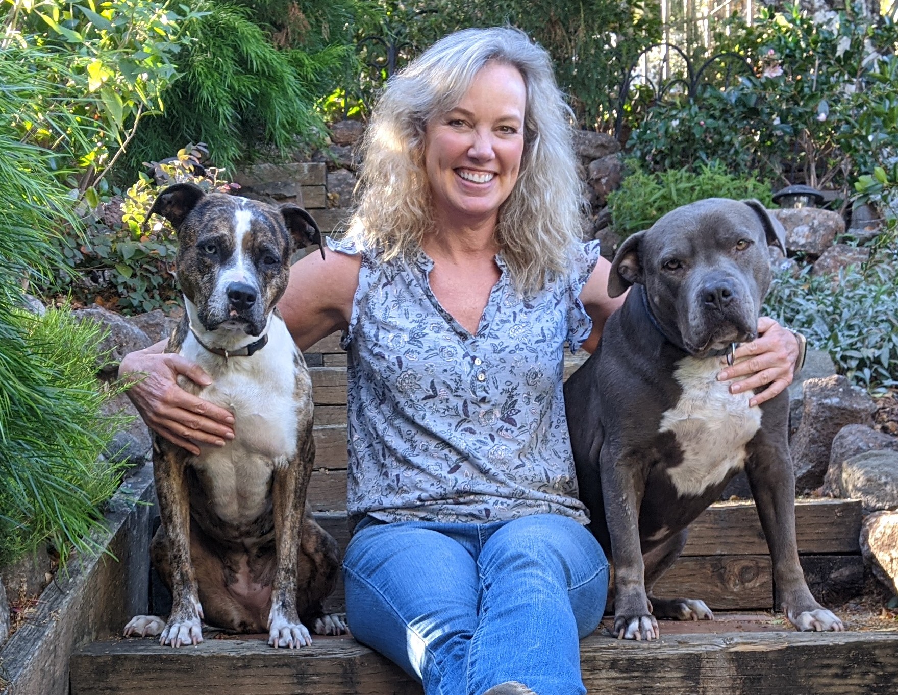 Barbara sitting with her dogs